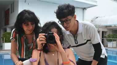 Comprehensive Sexuality Education participants in Colombia experimenting with a camera.
